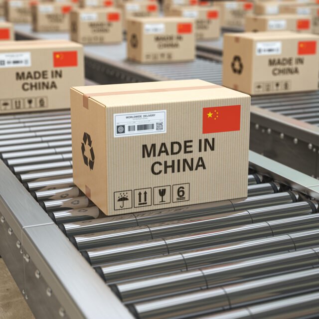 Made in China. Cardboard boxes with text made in China and chinese flag on the roller conveyor. 3d illustration